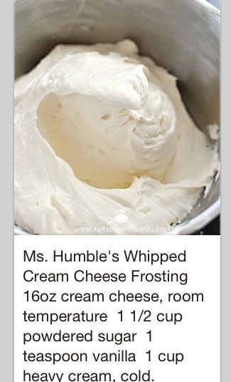 a bowl filled with white cream sitting on top of a table