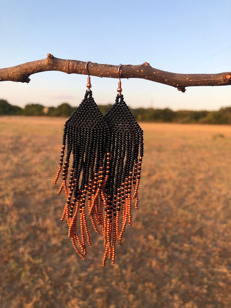 Copper and Black Beaded Earrings Black Beaded Fringe Earrings With Round Beads, Black Beaded Earrings With Round Beads And Fringe, Black Bohemian Earrings With Ear Wire, Black Beaded Fringe Earrings As Gift, Black Beaded Chandelier Drop Earrings, Black Dangle Jewelry With Beaded Fringe, Elegant Black Earrings With Colorful Beads, Bohemian Black Dangle Beads, Black Beaded Dangle Chandelier Earrings