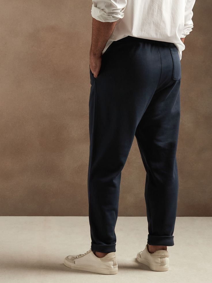 Ultimate comfort with athletic appeal, these French terry joggers have a smooth texture inside and out with a drawstring closure to keep cozy all season long.  SUSTAINABILITY: Made with 85% certified, organically grown cotton that's easier on the ear Navy Sporty Sweatpants With Elastic Waistband, Sporty Navy Sweatpants With Elastic Waistband, Cotton Drawstring Sweats For Jogging, Navy Sporty Joggers For Loungewear, Sporty Navy Joggers For Loungewear, Cotton Joggers With Comfort Waistband For Leisure, Navy Cotton Sweatpants Sportswear, Navy Cotton Athleisure Joggers, Sporty Navy Cotton Joggers