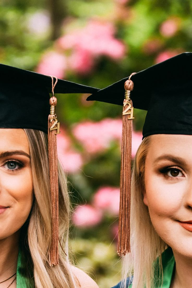 two women wearing graduation caps and gowns