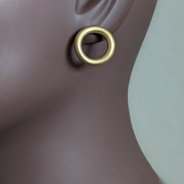 Olly earrings - these simple but stylish stud earrings are crafted from brass and coated with a matte gold plating for a timeless look. Perfect for any occasion, these earrings are a must-have for any luxury jewelry collection. Simple stud earrings, crafted from brass with a matte gold plating. Weight: 7.9 gm Dimensions: 1.9 cm x 1.9 cm Matte Gold Plated Minimalist Earrings, Matte Gold Round Tarnish Resistant Earrings, Matte Gold Minimalist Metal Earrings, Matte Gold Minimalist Earrings, Matte Gold Minimalist Earrings, Tarnish Resistant, Minimalist Gold Jewelry With Matte Finish, Modern Gold Jewelry With Matte Finish, Minimalist Matte Gold Jewelry, Minimalist Matte Finish Gold Jewelry