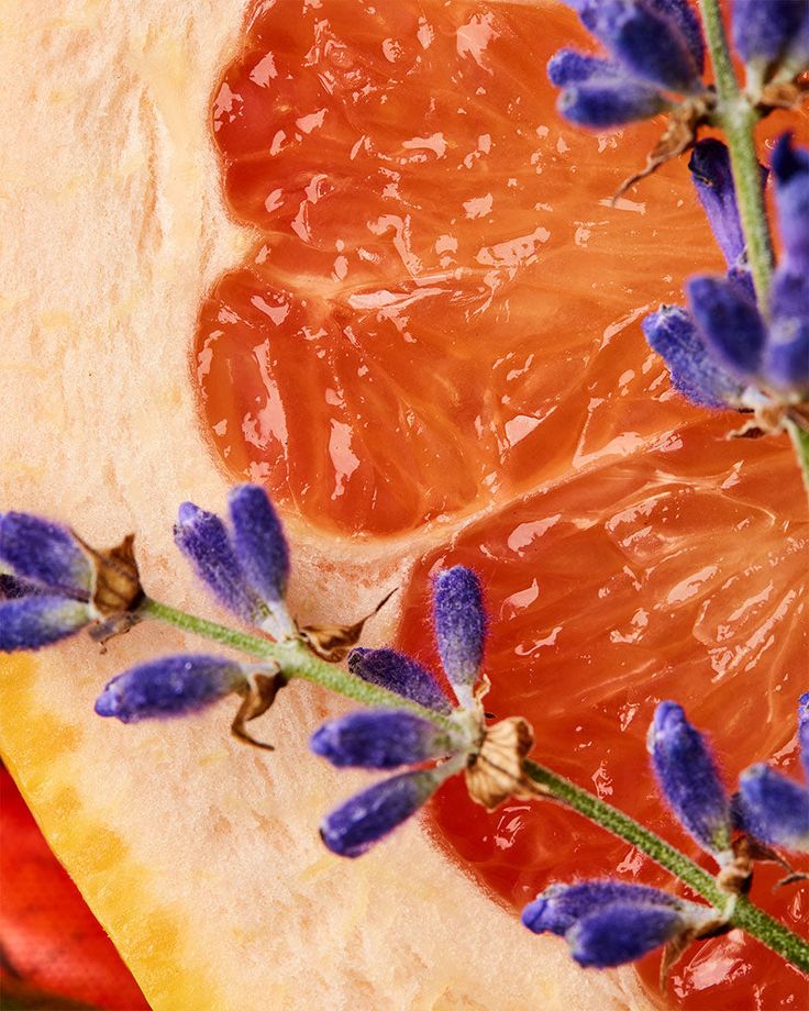 an orange slice with purple flowers on it