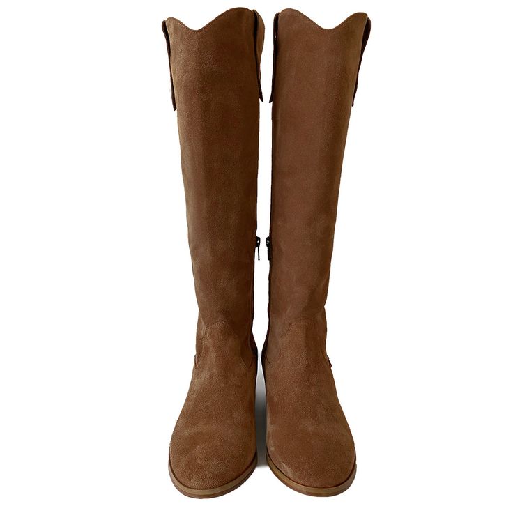 A never fading classic: these riding boots will give you a glamorous touch, whether you choose to wear them with a pair of jeans or a floral ruffle dress. The shaft is straight and its V shapes on the front and the back together with the side pulltabs give them a western look. Choose the calf circumference and height that best fit you, click the button above to get to know how to correctly measure your calf. Details: Fine suede leather upper Leather lining, leather insole Leather sole Knee-high Western Knee-high Boots With Suede Lining For Fall, Chic Leather Ranch Boots, Chic Leather Boots For Ranch, Brown Knee-high Riding Boots For Fall, Fitted Brown Knee-high Boots For Ranch, Brown Suede Knee-high Boots With Suede Lining, Brown Knee-high Boots For Ranch In Fall, Brown Wide Calf Boots With Suede Lining, Classic Cognac Heeled Boots For Fall