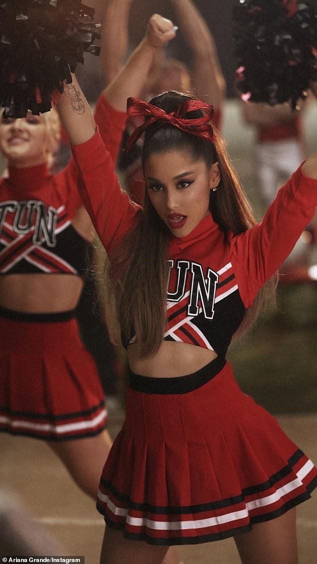 the cheerleaders perform for the crowd