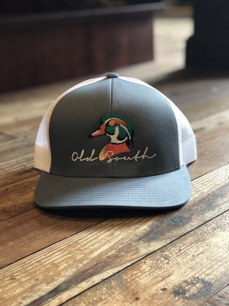 Keeping the hot southern sun out of your eyes and away from your face is important during the heat --both for guys and gals. The classic, wide-brimmed trucker subtly announces your southern roots. Stay in style with this Old South Wood Duck hat! Casual Curved Brim Snapback Hat For Country Events, Casual Snapback Hat For Summer Country Events, Casual Snapback Hat For Country Events, Country Style Adjustable Trucker Hat With Curved Brim, Summer Trucker Hat With Flat Brim For Country Events, Summer Casual Trucker Hat For Country Events, Casual Summer Trucker Hat For Country Events, Classic Adjustable Trucker Hat For Summer, Summer Country Style Trucker Hat With Curved Brim