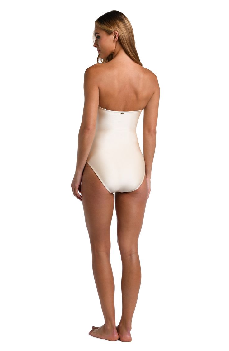 Feel your glowiest by the water in this ruched one-piece swimsuit designed with a sunny front cutout and supportive shaping details. Pull-on style Lined Removable, adjustable straps Removable cups Moderate back coverage 80% nylon, 20% elastane Hand wash, dry flat Imported Elegant Flattering Fit Swimwear For Beach, Elegant Smoothing Swimwear For Beach, Chic Smoothing Swimwear For Poolside, Elegant Strapless Swimwear For Pool, Strapless Ruched Nylon Swimwear, Smoothing Beachwear Bodysuit, Chic Swimwear With Smoothing Feature, Strapless Beachwear Bodysuit, Elegant Smoothing Nylon Swimwear