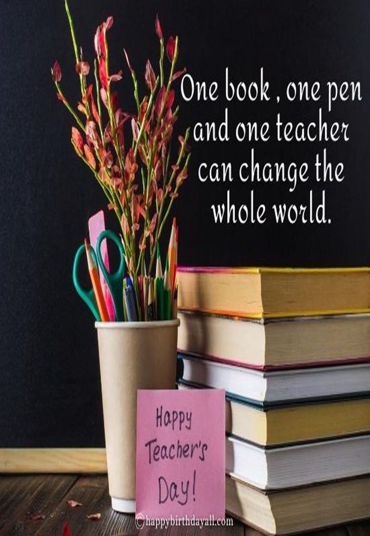 a stack of books sitting next to a vase filled with flowers and writing on it