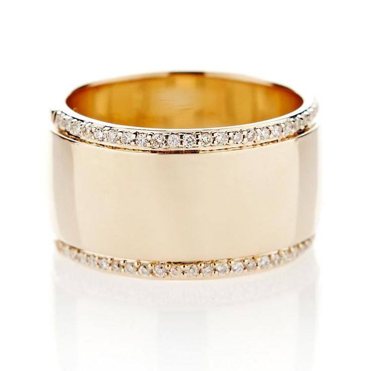 an 18k gold wedding band with diamonds