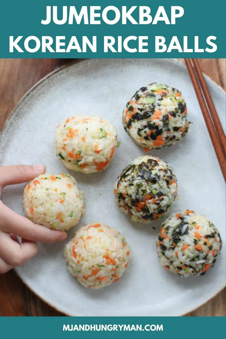 some kind of rice ball on a white plate with chopsticks next to it