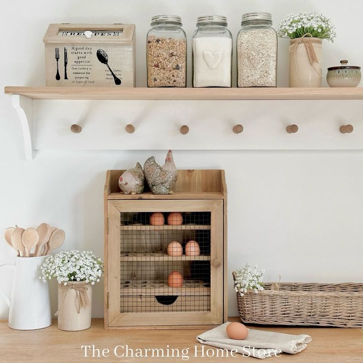 the shelf above the kitchen counter is filled with eggs and other things to cook in