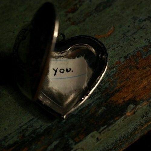 a heart shaped object with the word you written on it