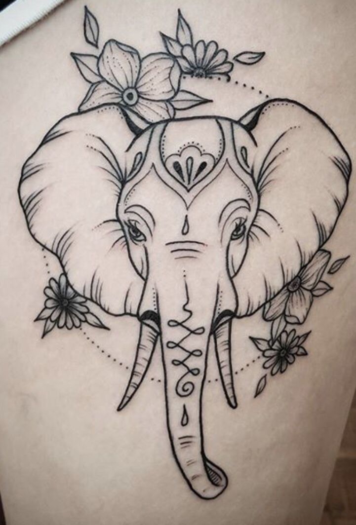 an elephant with flowers on it's head is shown in this tattoo style photo