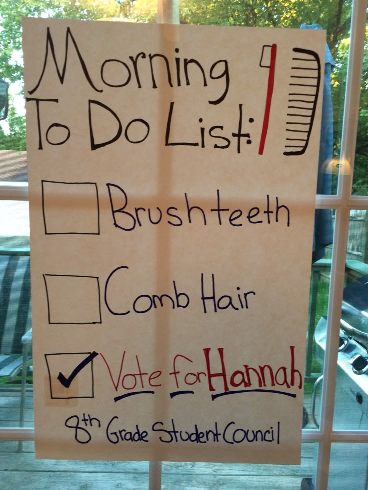 a sign posted on a window in front of a building that says morning to do list