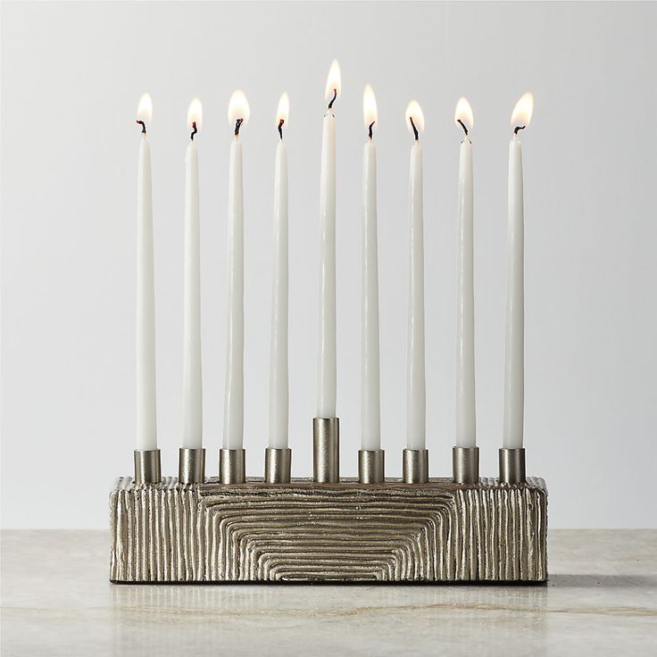 a candle holder with seven candles in it