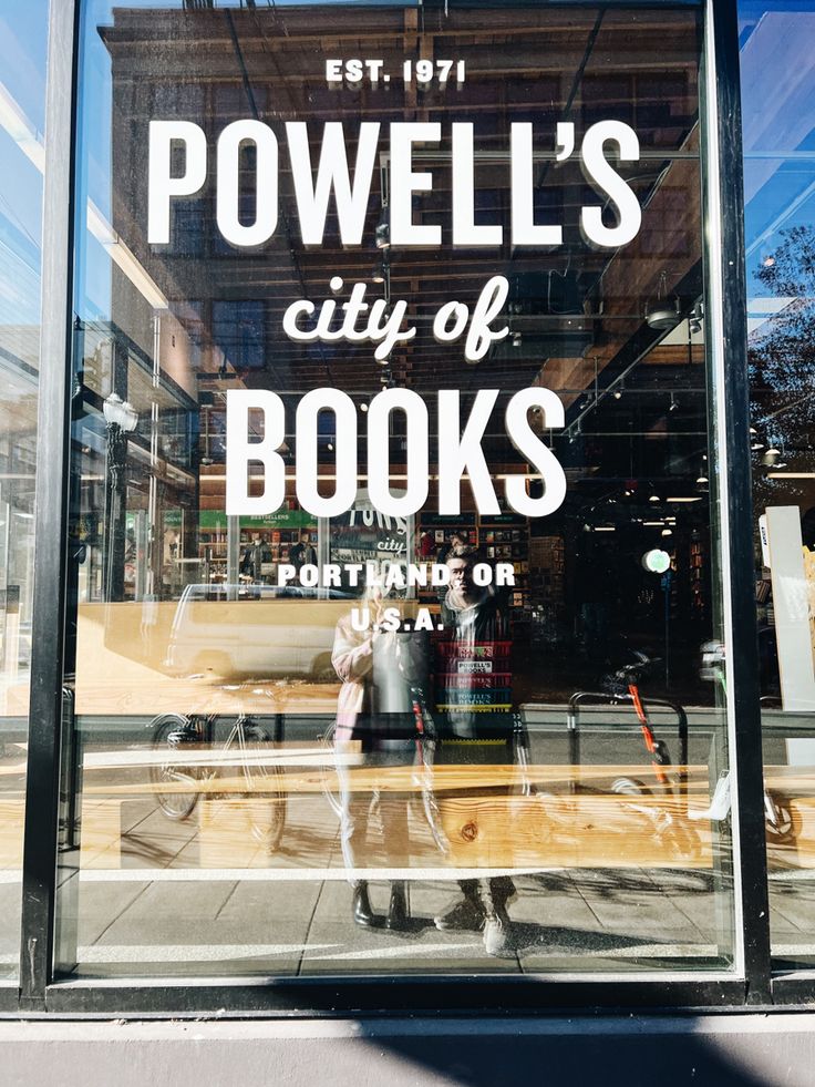 a store window with the words powell's city of books on it