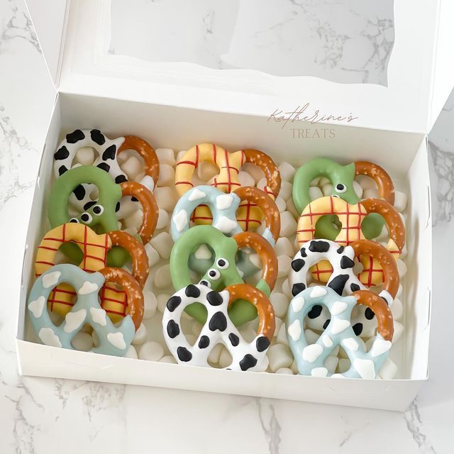 decorated pretzels in a box on a table