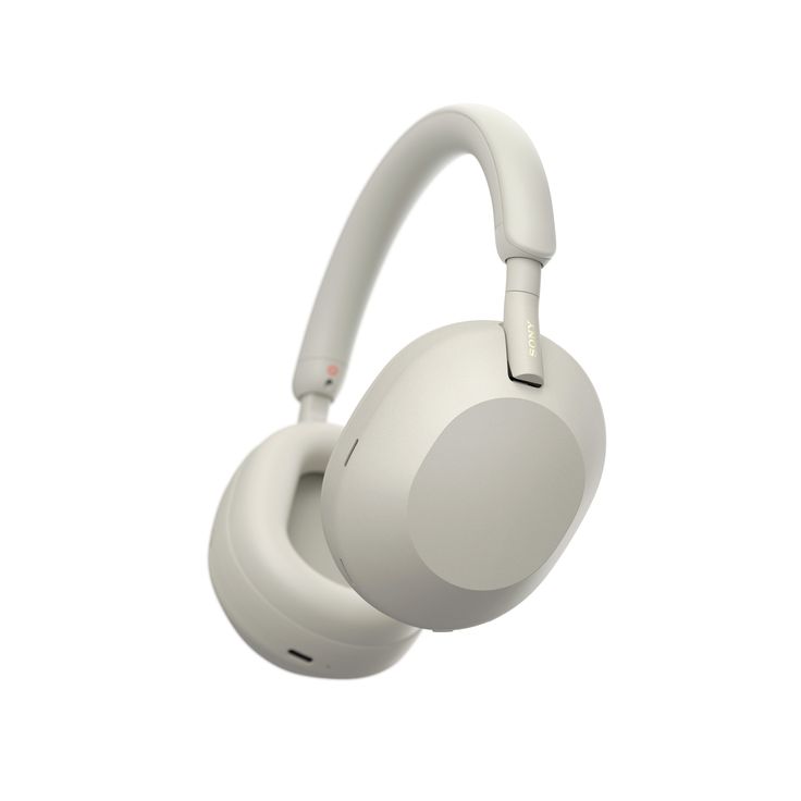 the white headphones are on display against a white background