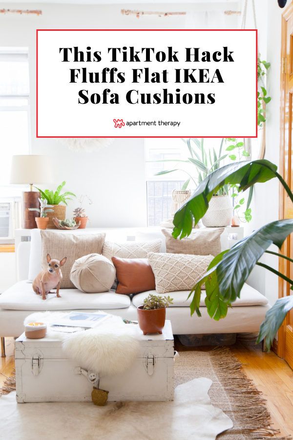 a living room with white furniture and plants in the corner, text reads this tittok hack fluffy flat ikea sofa cushions