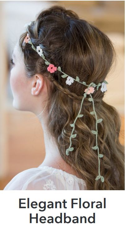 a woman with long hair wearing a flowered headpiece