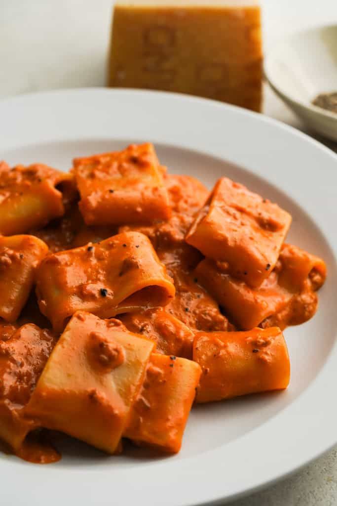 a white plate topped with tofu and sauce