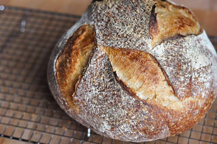 a loaf of bread sitting on top of a cooling rack