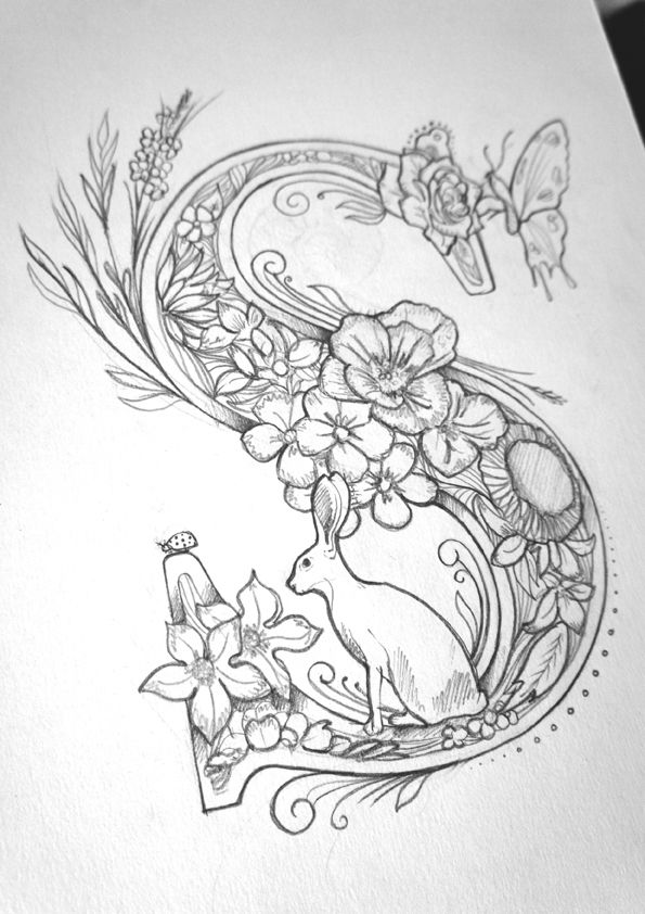 a drawing of flowers and a bird on a piece of paper with the letter e in it