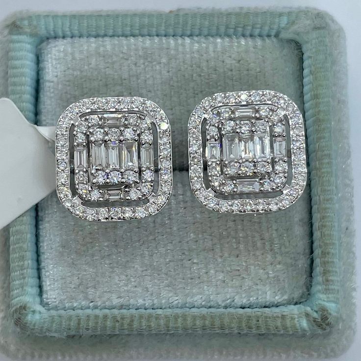 Classy Diamond Earrings Emerald Cut Halo Studs.  Nice size earrings you can dress up or down with.  Excellent craftsmanship, all diamonds are set smooth. Sits nice on the ear, the double halo of diamonds gives a lot of sparkles.  These square shapes are a bit different than your everyday round ones.  The screw backings are a secure fit.  Measures 13 x 12mm. These natural diamonds nice and sparkly.   Genuine Round and Baguette Cut Diamonds Total weight: 0.97 Carats  Clarity: SI/I Color: G All white and shiny diamonds, no cloudy or yellowish stones  Solid 14K White Gold   Comes with gift box #770PJ * We have been in the wholesale Jewelry business for over 30 years serving the community at the same location.  All diamonds we use are natural stones and fine quality gold.  Absolutely NO clarity Emerald Cut Diamond Earrings, Tina Snow, Square Diamond Studs, Square Diamond Earrings, Baguette Earrings, Morganite Wedding Rings, Emerald Cut Halo, Baguette Earring, Pink Morganite Engagement Ring