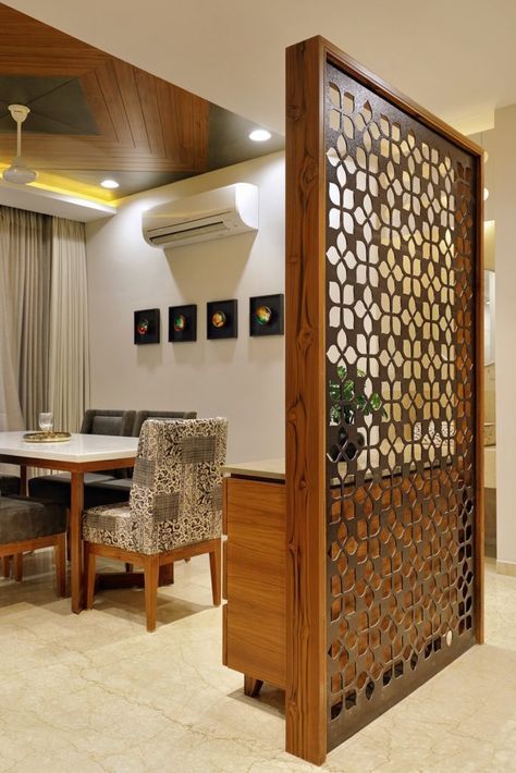 a room divider in the middle of a dining area