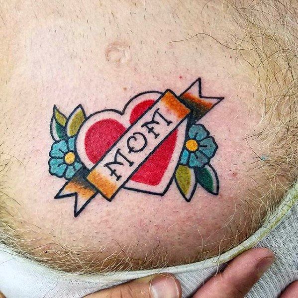 a man with a heart and flower tattoo on his stomach that says mom in the center