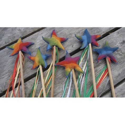 several colorful star shaped toothpicks on wooden sticks