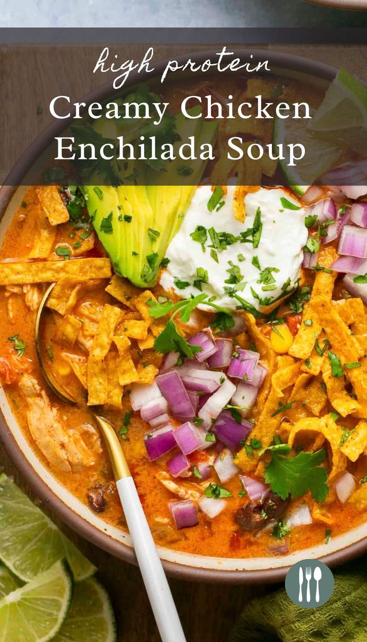 a bowl of creamy chicken enchilada soup with tortilla chips and sour cream