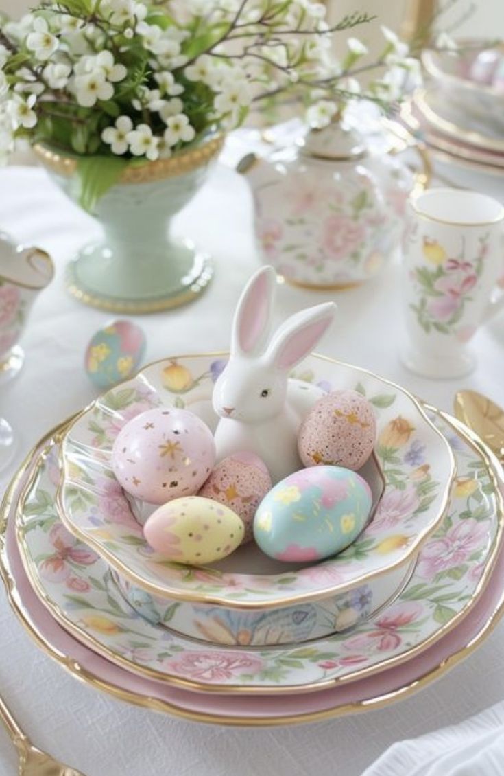 an easter table setting with pink and white flowers