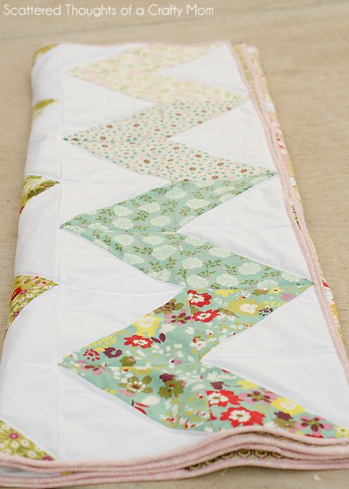 a close up of a quilted table runner