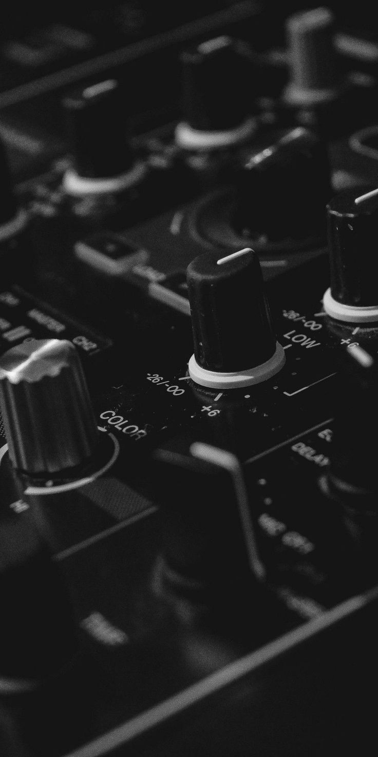 black and white photograph of knobs on a mixing board