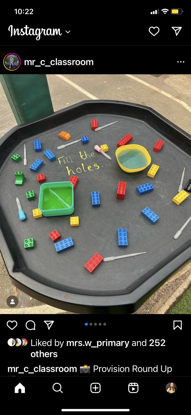 a black table with legos on it in the shape of a pool and other toys