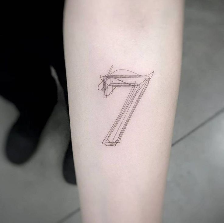 a tattoo with the number seven drawn on it