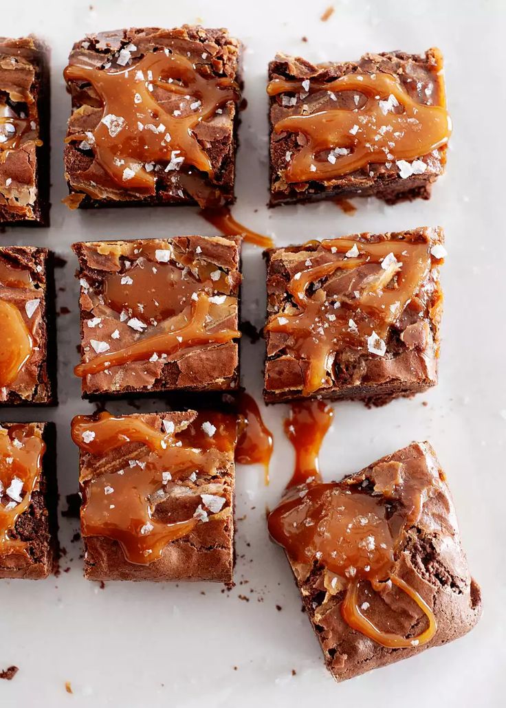 chocolate brownies with caramel drizzled on top and sea salt sprinkled all over them