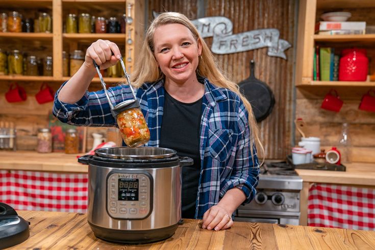 a woman is cooking in an instant pressure cooker with the words, canning with a pressure cooker? is it safe?