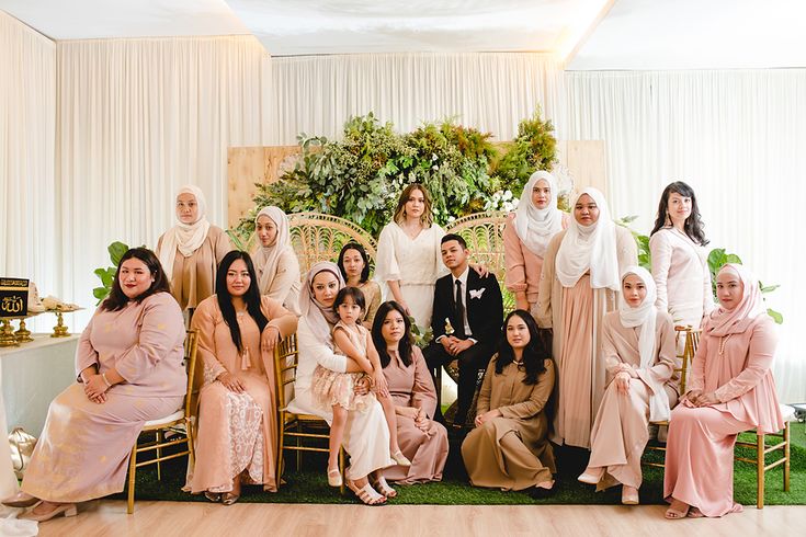 a group of women and men posing for a photo