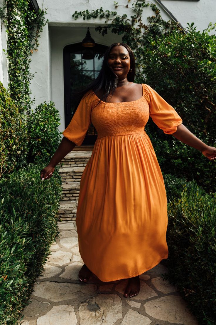 The Lucy dress is a new style for Roma. We wanted to bring the femininity of the cinching and mix with the utility of an everyday dress. Always with comfort and style in mind. The orange color is strong, happy and carries strong energy. Fabric: 100% Lenzing Ecovero Orange Ruched Dresses For Fall, Orange Midi Dress For Fall Day Out, Orange Midi Dress For Dress Down Occasion, Orange Knee-length Midi Dress For Brunch, Fitted Orange Dress With Smocked Bodice, Spring Orange Ruched Maxi Dress, Spring Orange Ruched Midi Dress, Orange Ruched Maxi Dress For Spring, Ruched Orange Maxi Dress For Spring