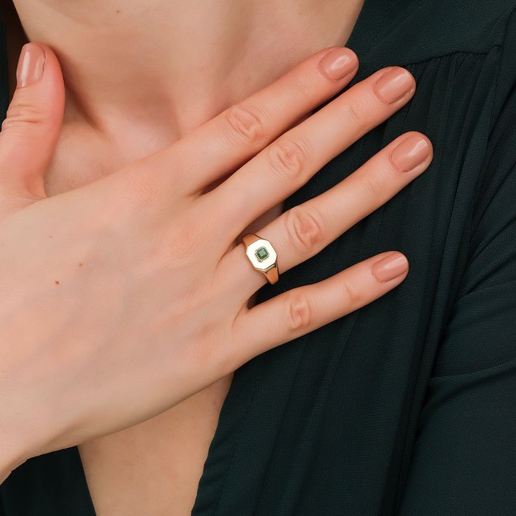 Lyra Modern royalty with a chic twist. A juicy green emerald, atop a throne of high-polished solid gold, creating ultimate shine! This ring is timeless yet modern, and will pair well with other rings on the same hand. - Handmade- Solid Gold- Natural Emerald- Total Emerald Carat Weight: 0.24 ctw- Dimension: 9 to 1.7 mm- Height of the Ring: 4.5 mm All Sarah Elise rings come beautifully boxed in suede pouches you can always use when traveling! Elegant Emerald Signet Ring, Modern Formal Emerald Jewelry, Timeless Polished Emerald Ring, Formal Gold Sapphire Ring For May Birthstone, Formal Yellow Gold Tsavorite Rings, Modern Polished Emerald Ring For Anniversary, Fine Jewelry Green Signet Ring With Birthstone, 14k Gold Green Ring With Polished Finish, Luxury Diamond Ring With May Birthstone