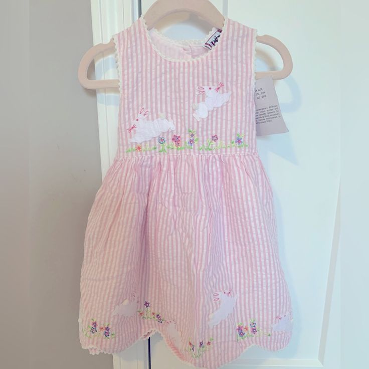 This Dress Is Absolutely Adorable! The Bunny Detail Makes This The Perfect Springtime & Easter Dress! Nwt Smoke/Pet Free Home Size 24 Months Easter Dresses For Girls Children, Sleeveless Easter Dresses For Playtime, White Cotton Easter Dress, Casual Cotton Easter Dress, Casual Cotton Dress For Easter, White Sleeveless Easter Dress, Casual Seersucker Dresses For Spring, Gingham Seersucker Dresses For Spring, Striped Dresses For Summer Playdate