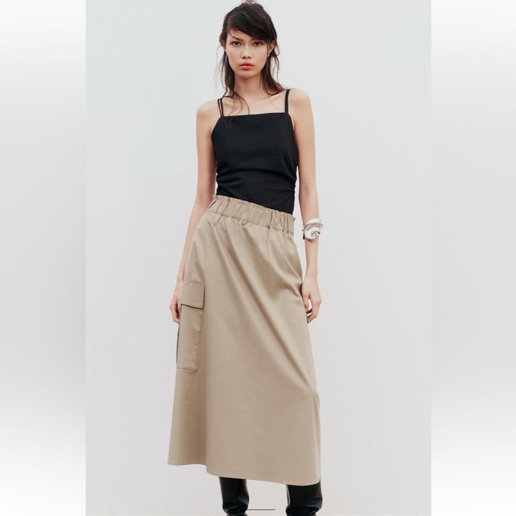 Long Skirt With Elastic Waist And Ruching. Side Patch Pockets With Flaps.Mid-Camel. Brand New With Tags. Full Waist 28” And Beyond . Full Hip 48” ,Length 35” Casual Neutral Skirt For Fall, Summer Workwear Khaki Cargo Skirt, Casual Khaki Maxi Skirt For Spring, Casual Beige Cargo Skirt For Work, Casual Day Out Skirt In Neutral Color, Casual Neutral Flowy Skirt, Casual Beige Maxi Skirt For Fall, Casual Neutral Midi Skirt, Casual Neutral Skirt