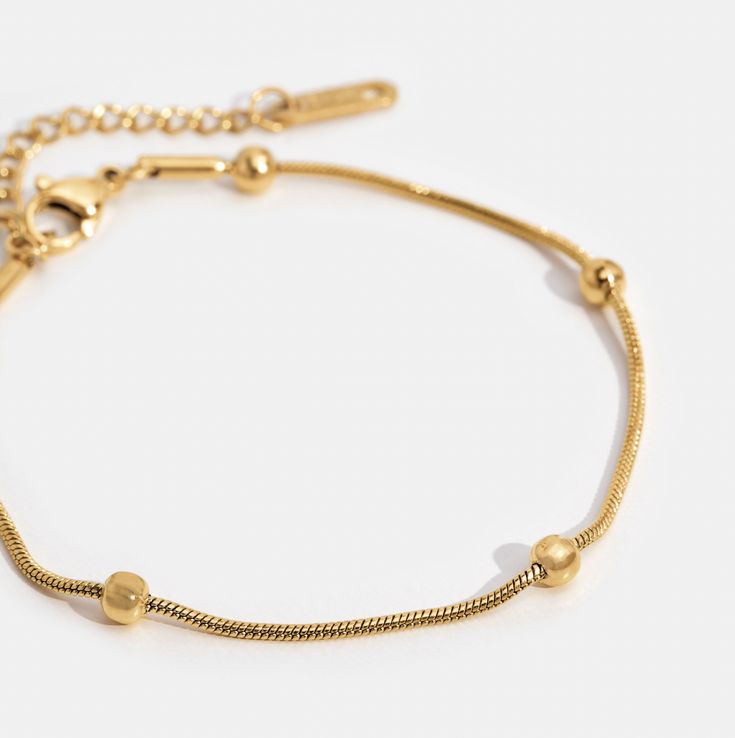 Simple, elegant, and perfect for day or night. This stunning bracelet is guaranteed to be an everyday essential for years to come. Gold plated Titanium steel Length: 6.3in (+ 2in adjustable) Lobster clasp closure Hypoallergenic, lead & nickel free If you aren't in LOVE with your purchase, please let us know within 30 days of receiving your item, and you'll receive a stress-free refund. Adjustable Metal Chain Bracelet, Tarnish Resistant, Dainty Hypoallergenic Stainless Steel Bracelets, Adjustable Minimalist Stainless Steel Bracelets, Adjustable Tarnish Resistant Metal Bracelet, Adjustable Stainless Steel Chain Bracelet With Extender, Adjustable Gold Charm Bracelet For Everyday, Adjustable Trendy Chain Bracelet Tarnish Resistant, Trendy Adjustable Tarnish Resistant Chain Bracelet, Adjustable Trendy Tarnish Resistant Chain Bracelet