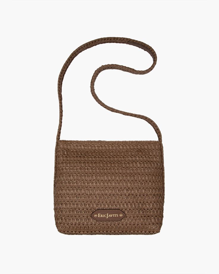 A women's designer crossbody bag for sale online of woven raffia with top zipper closure is super cute for use throughout spring-summer months. The textured weave is intricate with its long strap extending down the sides of the bag body. The mid-size rectangular shape is soft and squishy and feels body friendly. A roomy outer pocket on reverse is for easy access to phone or glasses. Inside: durable cotton canvas lining, sidewall zipper compartment and roomy patch pocket. Dimensions: Front and ba Designer Crossbody Bag, Closure Weave, Gold Sand, Woven Raffia, Designer Crossbody, Natural Gold, Designer Crossbody Bags, Mid Size, Summer Months