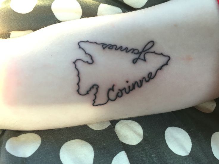 a woman's arm with a tattoo that says virginia on the middle of it