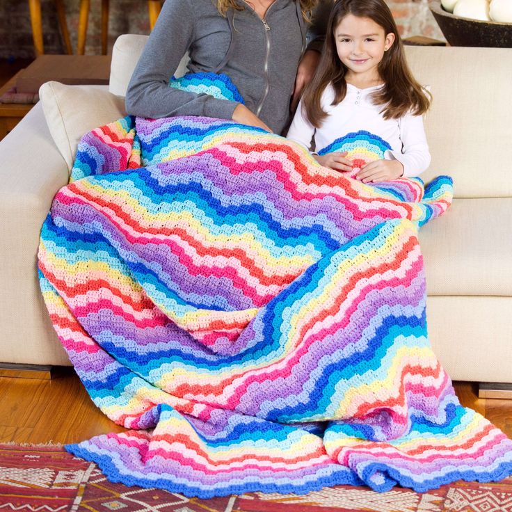 Free Easy Crochet Afghans/Blankets Pattern For HomeSomewhere over the rainbow and on your project list is this cheerful crochet throw that adds a happy vibe to any space! Inspired by the colors of Red Heart Super Saver, make this project as is, or swap out shades for a different combination you enjoy. Bursting with lively personality, this 59" x 85" blanket is perfect for cuddling in the kids' room, rec room, family room and more!Material NotesEverything you need to make your new project is included in this kit! Time to get stitching, and don’t forget to share your progress! The Crochet Crowd, Crochet Crowd, Heart Rainbow, Crochet Afghan Patterns Free, Crochet Afgans, Easy Crochet Patterns Free, Crochet Blanket Afghan, Manta Crochet, Afghan Patterns