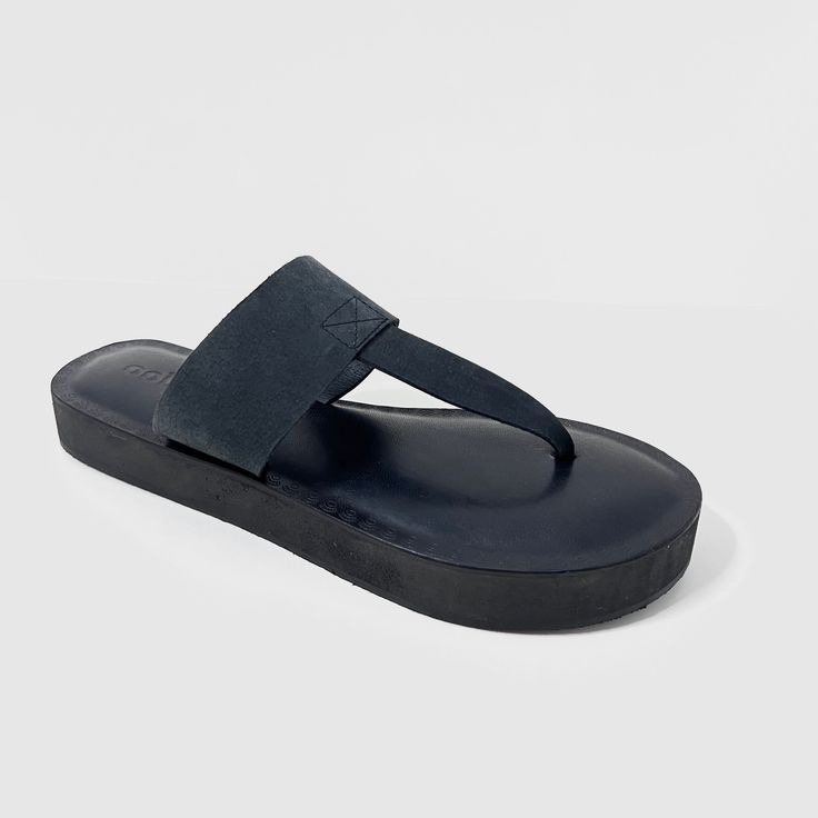 The Katherine Black leather designer flip flop thong sandal combines style and comfort with its mid eva sole cushioning. These sandals provide excellent support for all-day wear. Expert craftsmanship and high-quality leather make this a must-have addition to your summer wardrobe. Features: Slip-on design Cushioned mid eva sock Embossed sock design for elegant look Traditional Thong upper design Composition: Upper - 100% Leather Lining - 100% Leather Sock - 100% Leather Outsole - 100% Rubber Modern Slip-on Flip Flops With Removable Insole, Leather Toe Post Footbed Sandals For Summer, Leather Round Toe Flip Flops For Beach, Leather Slippers With Cushioned Footbed For Vacation, Comfortable Leather Flip Flops For Summer, Modern Leather Footbed Sandals With Textured Sole, Summer Leather Toe Loop Flip Flops, Modern Slip-on Flip Flops With Rubber Sole, Leather Beach Flip Flops With Cushioned Footbed