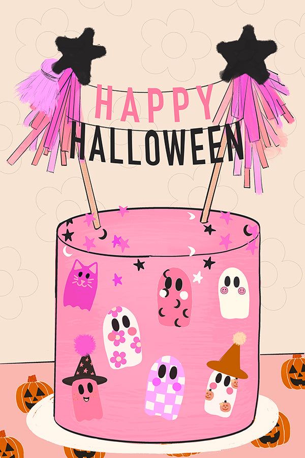 a pink halloween cake with decorations on top and the words happy halloween written above it