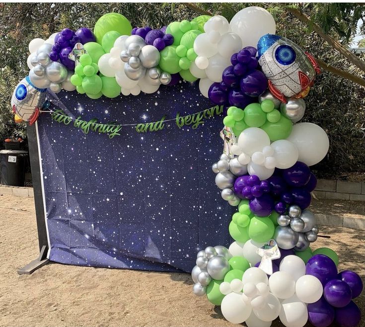 an arch made out of balloons and stars